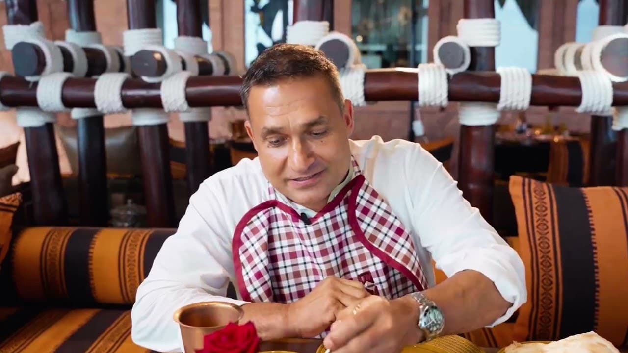 Chef Peter Kuruvita smiling in a restaurant kitchen